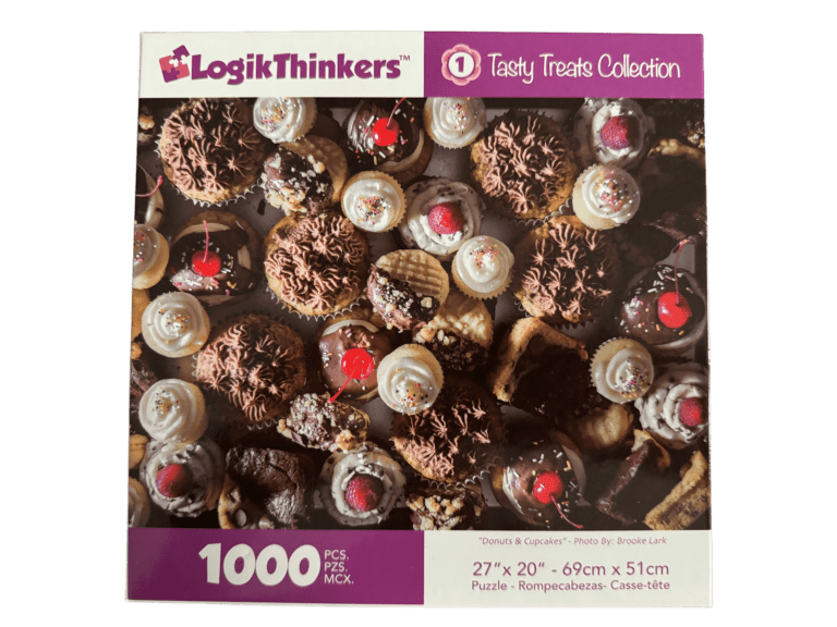 A box of cookies and cupcakes on top of a table.