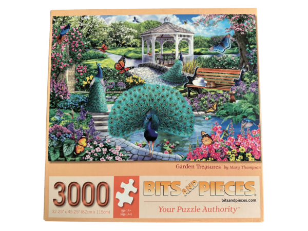 A large puzzle of a garden with peacocks and butterflies.