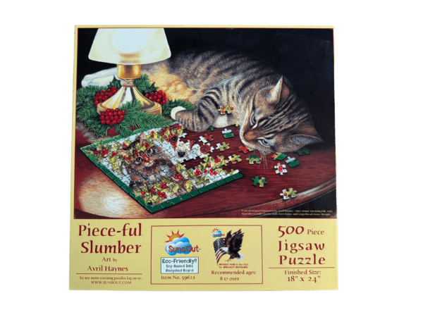 A cat is laying on the table with a puzzle.