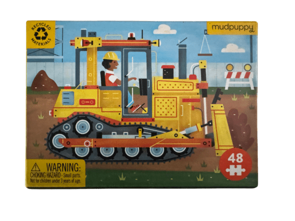 A puzzle of a yellow tractor with a man on it.