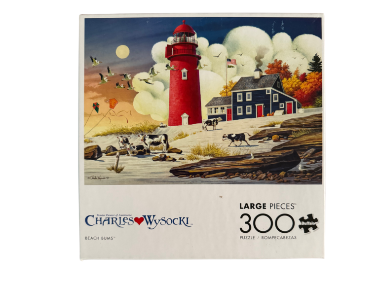 Red lighthouse and cows on beach 300 piece puzzle.