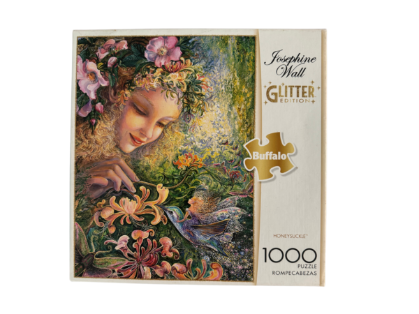 1000 piece glitter puzzle of a woman and hummingbird.